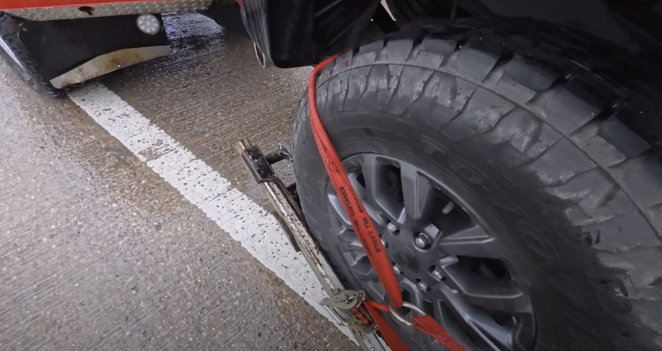 Motorcycle towing with specialized equipment and secure straps